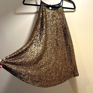 Swingy strappy gold sequin top from Torrid